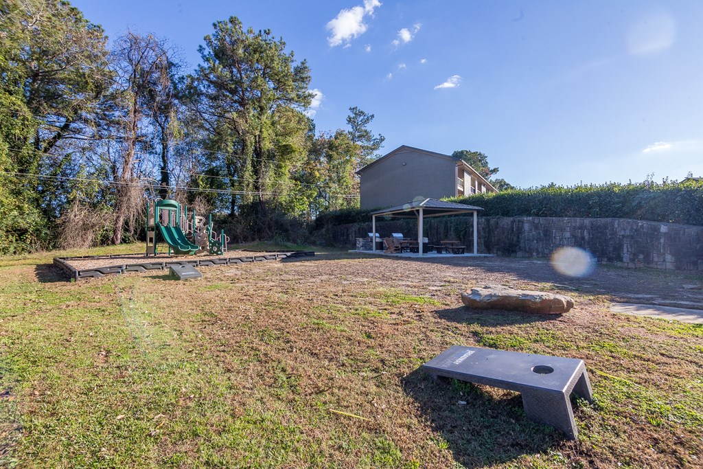 a backyard with a playground and a picnic table at Broadway at East Atlanta, Atlanta, 30316
